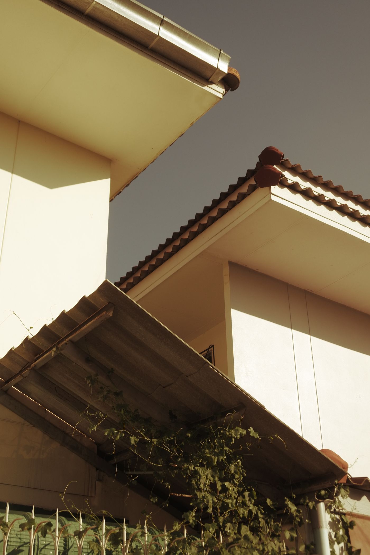 Tiled roof and white building detail